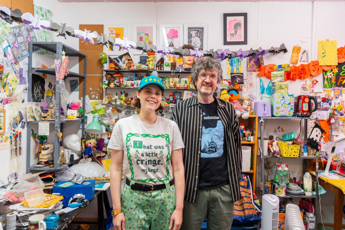 Two creatives in a colourful studio setting